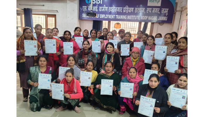 Women trainees posing with their certificates during valedictory function of a training programme at SBI-RSETI, Jammu.