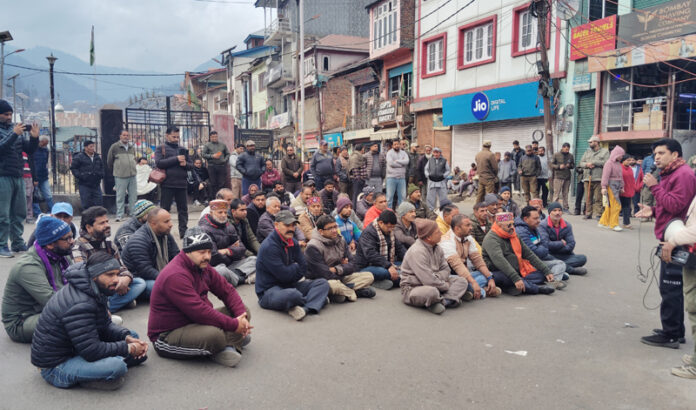 Protesters during a sit-in at Bhaderwah on Sunday. — Excelsior/Tilak Raj