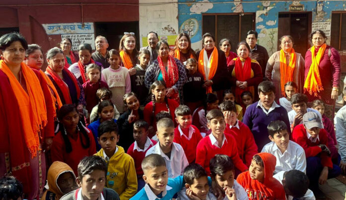 Ritika Trehan posing along with the students at Government Middle School Kachi Chawni on Monday.