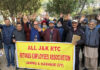 Retired JKRTC employees staging protest near Press Club in Jammu on Friday. -Excelsior/Rakesh