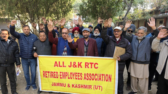 Retired JKRTC employees staging protest near Press Club in Jammu on Friday. -Excelsior/Rakesh