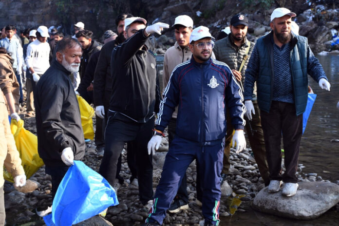 DC Rajouri leading drive to remove garbage from Darhali river on Tuesday.