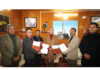 LG Kavinder Gupta and representives of RRU displaying copies of MoU at Leh.