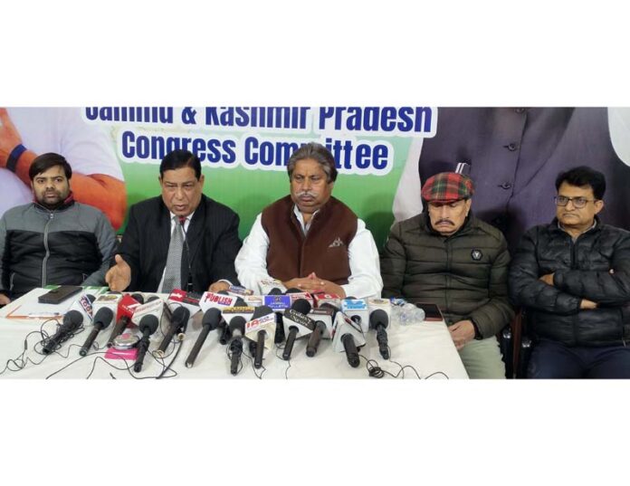 Senior Cong leaders Raman Bhalla & Ravinder Sharma addressing press conference in Jammu. -Excelsior/Rakesh