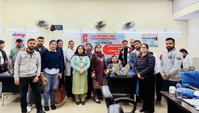 A volunteer donating blood during a camp organized in Jammu.