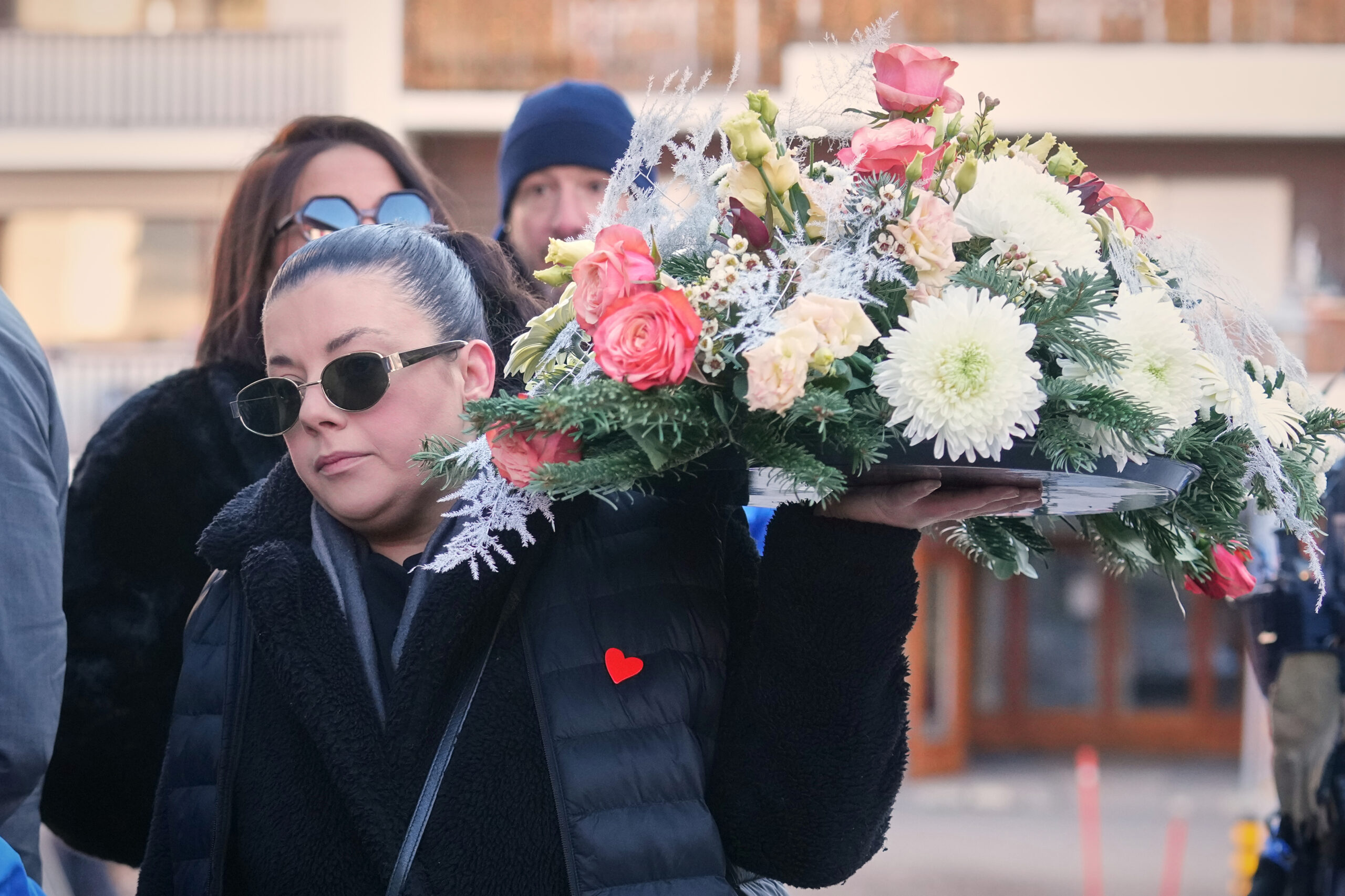 Mother says goodbye to her son as Swiss community grieves after deadly fire