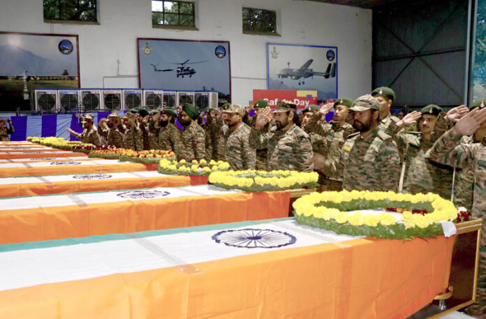 Army personnel paying tribute to the mortal remains of the 10 soldiers who lost their lives in a road accident in Doda district, during a wreath-laying ceremony, in Jammu on Friday. (UNI)