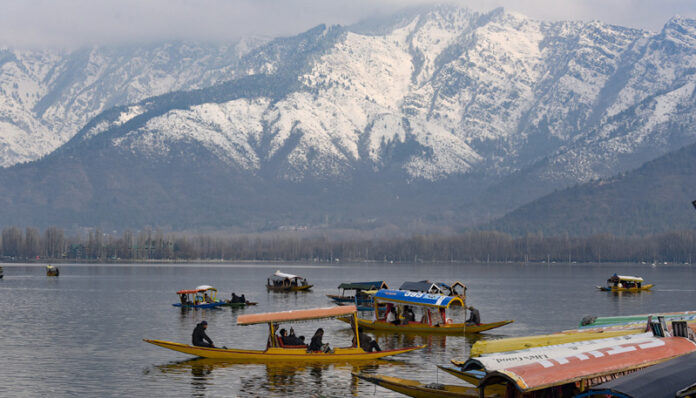 Tourists enjoying Shikara ride in Dal at the foothills of snow covered mountains in Srinagar. Another pic on page 4. -Excelsior/Shakeel Tourists enjoying Shikara ride in Dal at the foothills of snow covered mountains in Srinagar. Another pic on page 4. -Excelsior/Shakeel