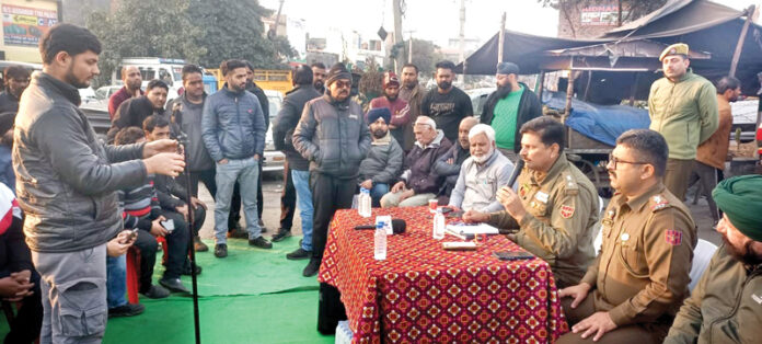 SP City South Dr Ajay Sharma meeting transporters.