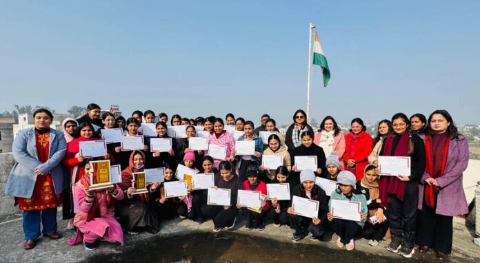 Winners and participants displaying their certificates while posing with guests.