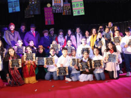 Participants posing along with certificates and dignitaries during a programme.