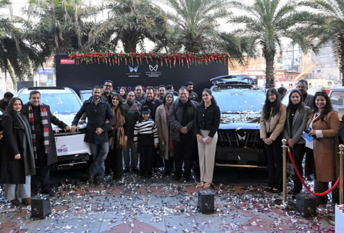 Chairman of Astro India Automobile, Mohinder Gupta and others during unveiling of Mahindra XEV 9S and XUV 7XO at its dealership in Bari Brahmana, Jammu.