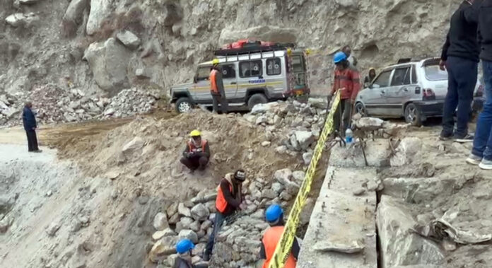 Vehicles move on a road after BRO restored a bridge within hours in Paddar area of Kishtwar. -Excelsior/Tilak Raj