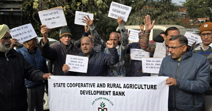 Depositors of SCARD Bank staging protest at Jammu on Monday. -Excelsior/Rakesh