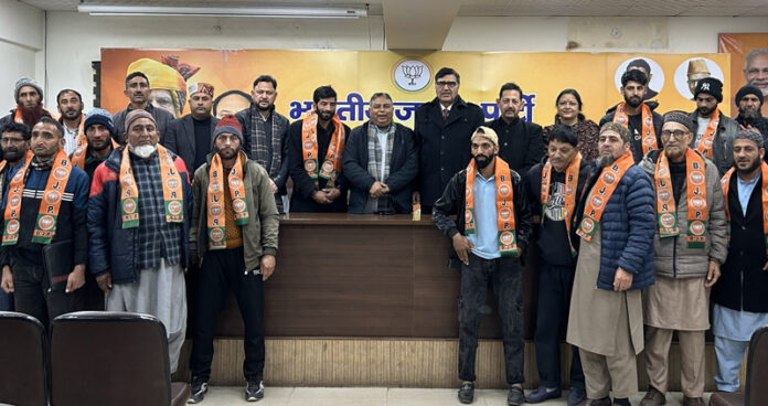 DDC Neel, Bashir Ahmed Naik along with his supporters being taken into BJP fold at Jammu on Saturday.