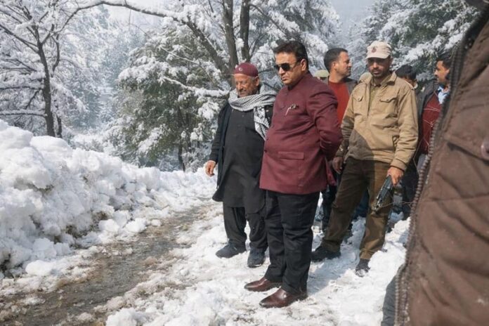 Senior BJP leader during visit to Budhal area of Rajouri to superwise road clearance work.