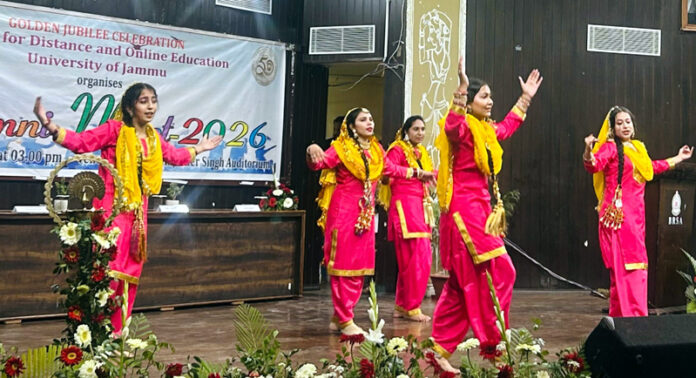 Students presenting cultural item during Alumni Meet at CDOE.