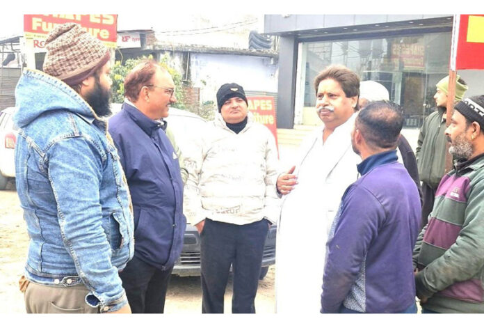 Senior Cong leader Raman Bhalla interacting with people in Jammu South.
