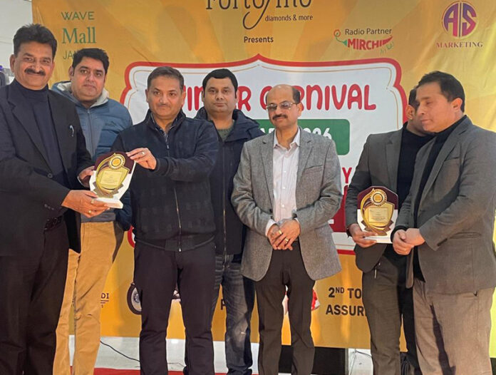Ramesh Angaral, DIG presenting prizes to the winners at Wave Mall in Jammu. Ramesh Angaral, DIG presenting prizes to the winners at Wave Mall in Jammu.