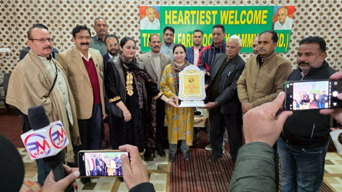 ADC Jammu Ansuya Jamwal receiving a memento from members of Tawi Welfare Society at Surya Chak, Jammu.