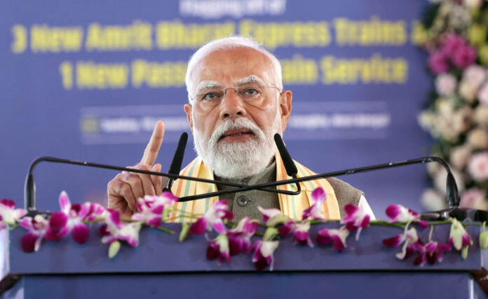 Prime Minister Narendra Modi addresses the gathering at the inauguration and foundation stone laying of various projects in Singur, West Bengal on Sunday. (UNI)