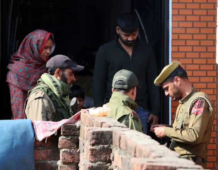 Police and CRPF personnel conduct searches in Narwal-Bhatindi area ahead of Republic Day, in Jammu on Wednesday.