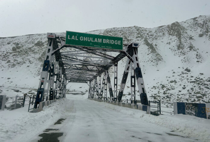 A snow-clad view of Lal Gulam Bridge on Mughal Road in Shopian on Tuesday. -Excelsior/Younis Khaliq