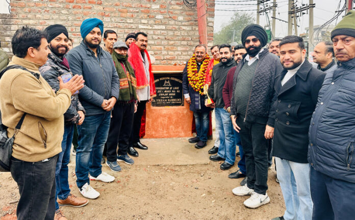 MLA Bahu, Ch Vikram Randhawa kick starting upgradation works of lanes and drains in Sanjay Nagar on Friday.