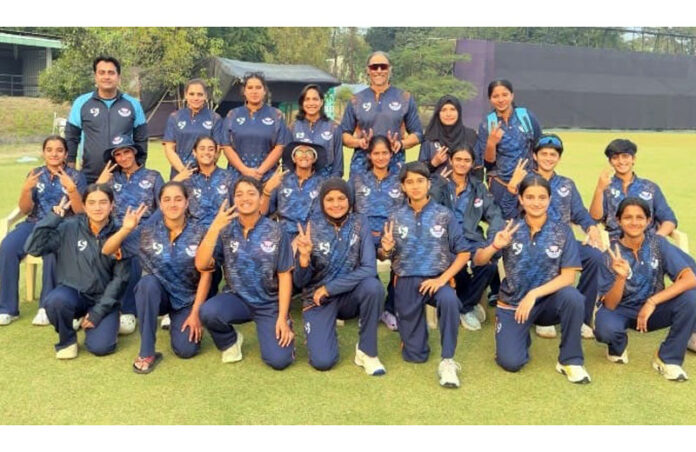 Winning team posing for group photograph.