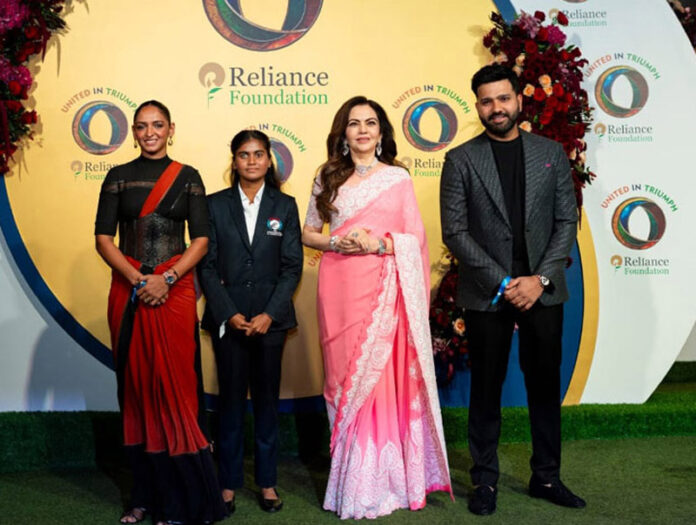 Nita Ambani posing with three World Cup-winning captains at 'United in Triumph' event in Mumbai.