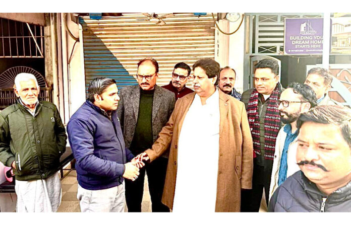 Senior Cong leader Raman Bhalla interacting with people in R S Pura on Tuesday.