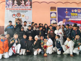 Players posing along with winners during prize distribution ceremony.