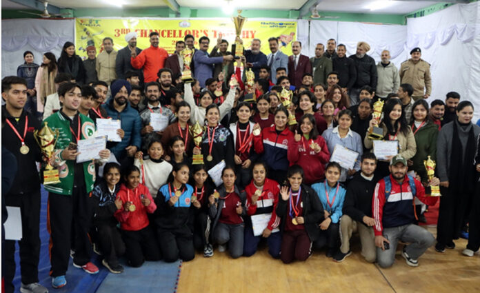 Winners posing along with trophies and medals during prize distribution ceremony.