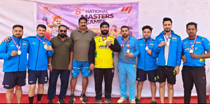 Masters athletes posing along with medals. Masters athletes posing along with medals.