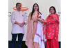 Nosheen Sheikh receiving award for improving lives of women and children in Kashmir.