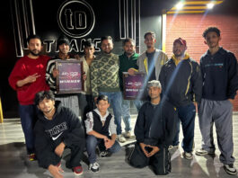 Organisers posing along with winners during a programme.