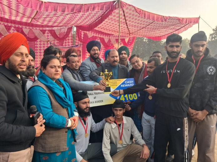 Winners posing along with dignitaries during an event.