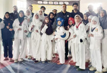 Distt Bandipora Taekwondo C’ship inaugurated at JKSC Shadipora Taekwondo players posing with guests and officials at Indoor Stadium, Shadipora in Bandipora district.
