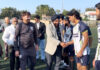 Dignitary interacting with players before start of match.