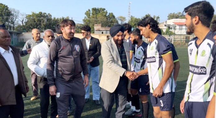 Dignitary interacting with players before start of match.