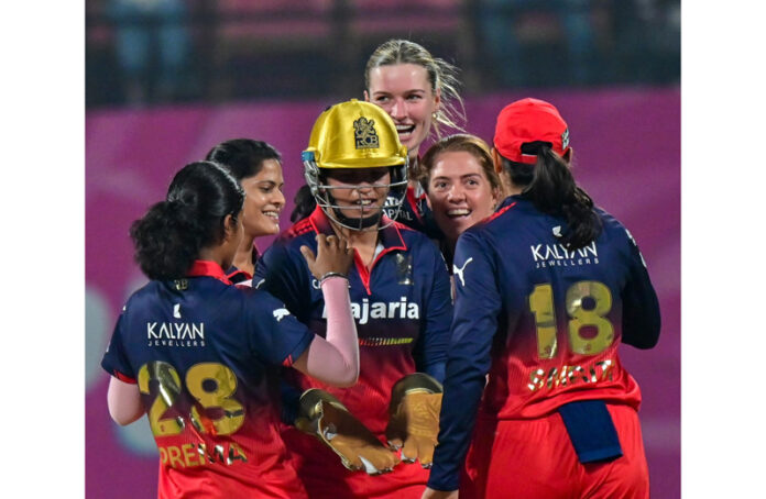 RCB players celebrating after beating MI in WPL opener at Navi Mumbai.