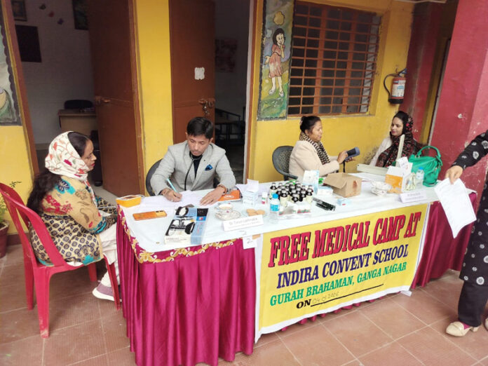 Doctors attending to patients during a medical camp at Indira Convent School, Gurah Brahmana, Jammu.
