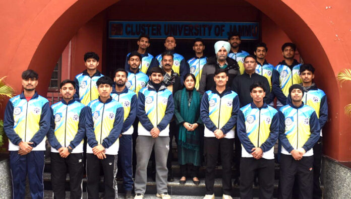 Football players posing along with management.