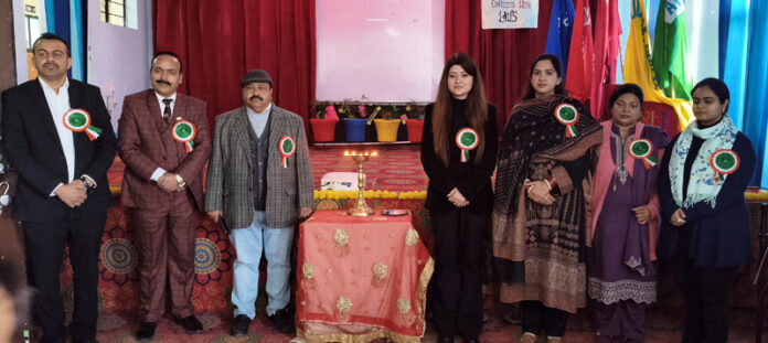 Dignitaries posing along with school management during a programme.