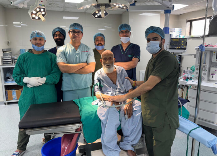 A team of doctors posing with a patient on whom a complex surgery was performed at Ankur Maitrika Hospital, Jammu.