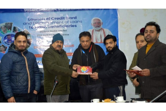 DC Poonch distributing loan sanction order.