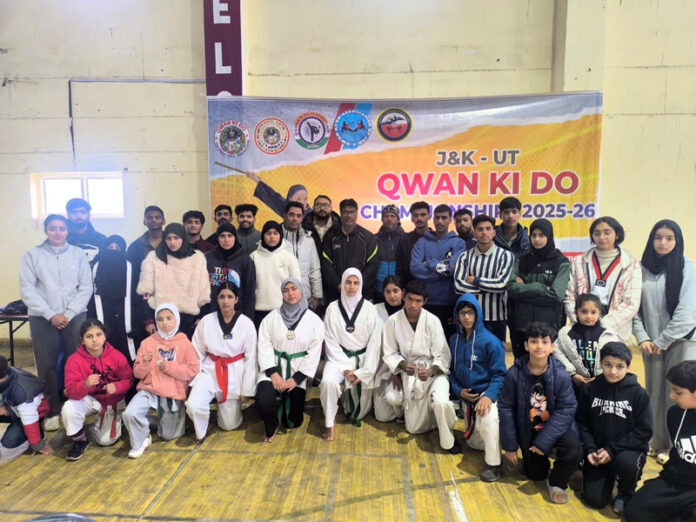 Athletes posing along with dignitaries.