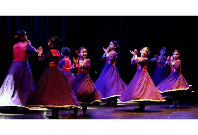 Artists performing a classic dance performance during a function in Jammu.