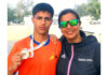 Silver medallist Muneer Hussain with his coach Bilquis Mir.