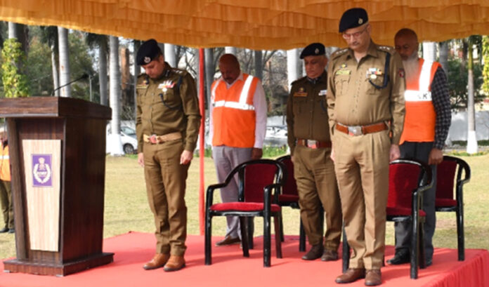 Police officers and paying tribute to freedom fighters at SDRF 2nd Battalion Headquarters on Martyrs Day in Jammu on Friday .